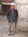 Tibet, Shigatse, September 2003.
Tibetan boy.
Small Tibetan boy contemplating.
