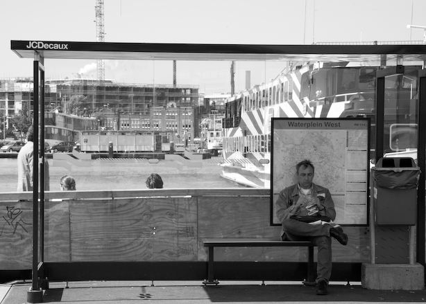 The Netherlands, Amsterdam,
May 2006. 
Waiting 5.
People waiting on the “De Ruyterkade” in Amsterdam.
